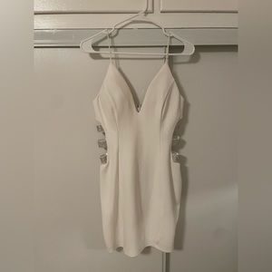 White mini dress with side rhinestone straps design